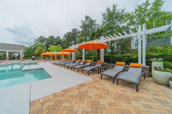 Expansive swimming pool with sundeck